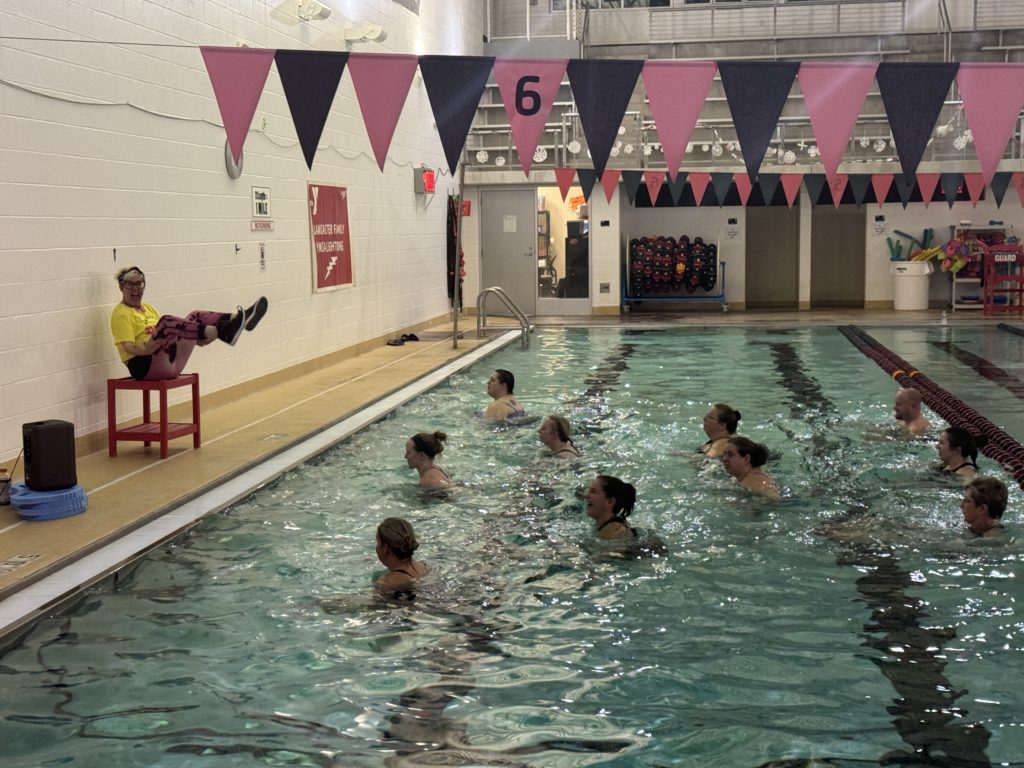 fitness participants in the pool aqua zumba class