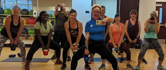 womens group fitness lifting weights and weight training